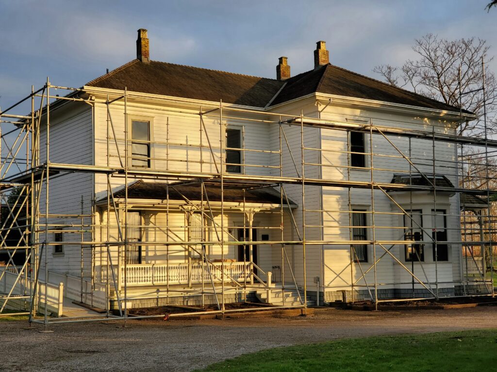 A house with that has scaffolding in front.