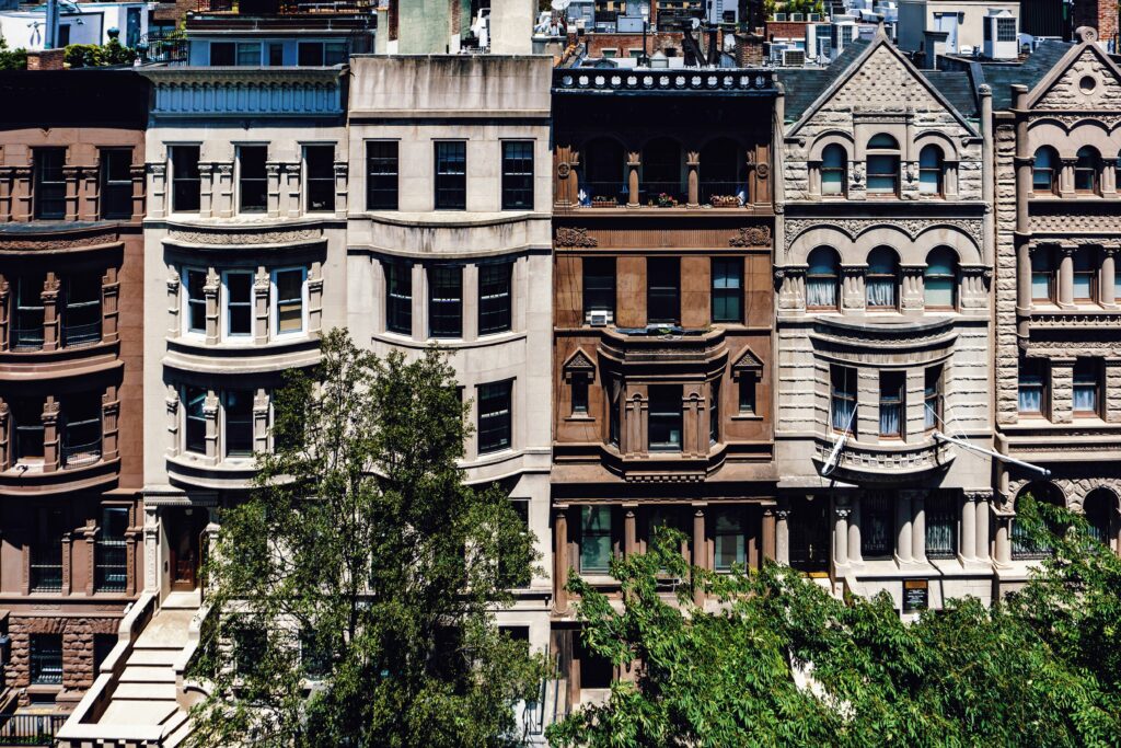 A photo of buildings/houses in New York taken from another building.