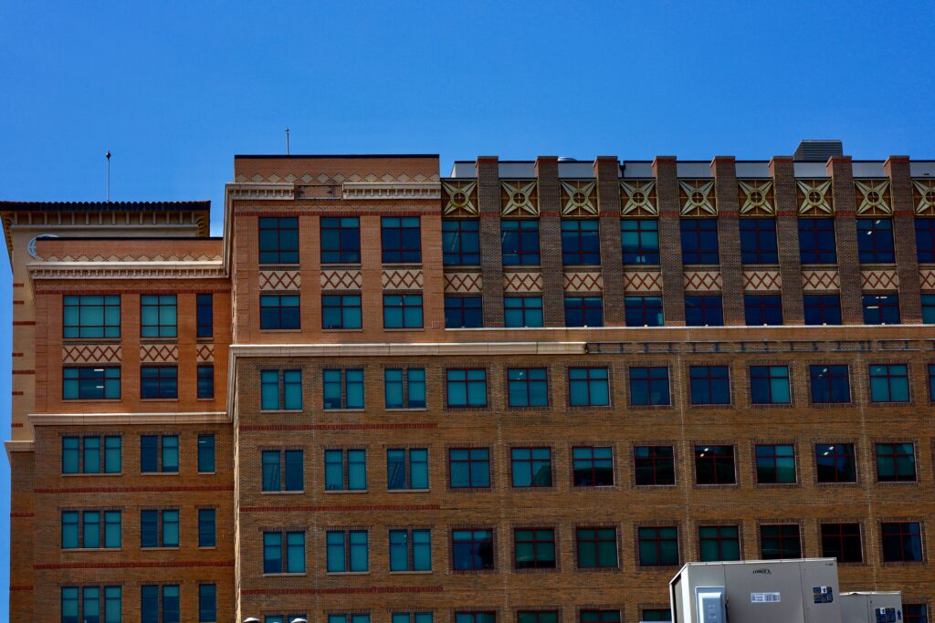 Front view of a building in Kansas with a truck below