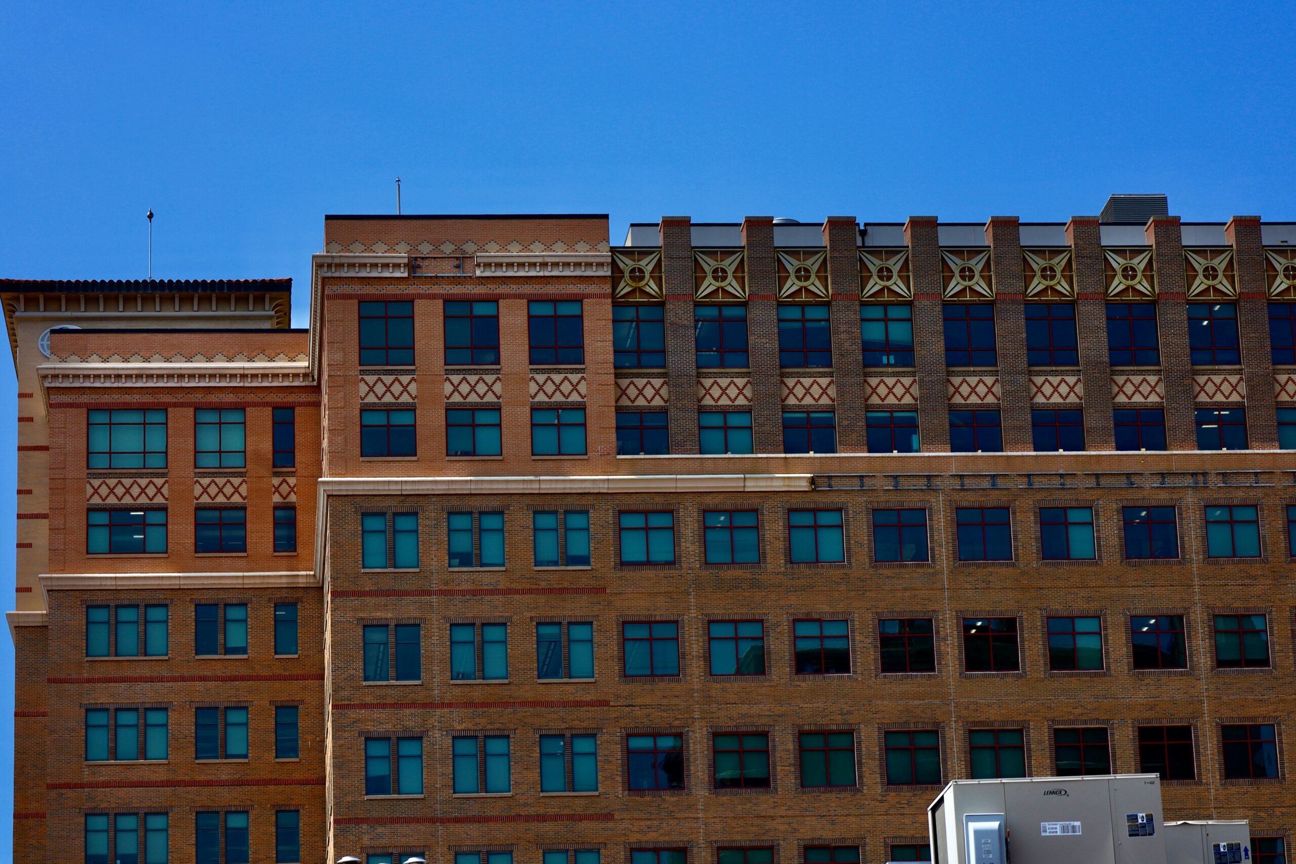 Front view of a building in Kansas with a truck below