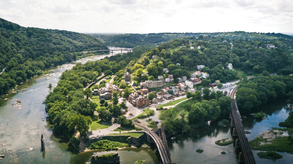 Top view of west Virginia's town Harpers Ferry with houses, roads and river.